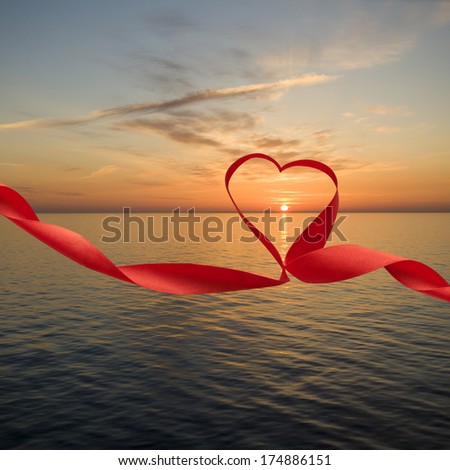 Romantic sunset at sea picture with ribbon and heart