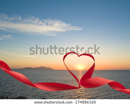 Romantic sunset at sea picture with ribbon and heart