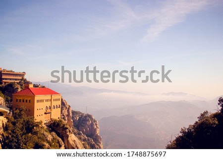 beautiful mountain landscape with a house. Sky, mountains, building in Europe. A photo for the background, site, travel, brochure, advertising. Beautiful sky, delicate colors