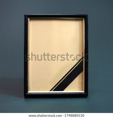 mourning photo frame with black ribbon