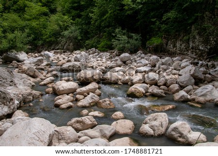 
Water flowing between rocks in an Italian natural park