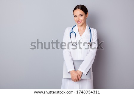 Photo of cheerful family doc lady hold hands modern technology notebook laptop come medical conference meeting wear stethoscope white lab coat isolated grey color background