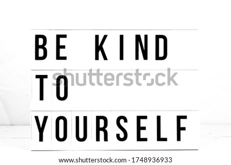 Inspirational Be Kind To Yourself quote on vintage retro board. Concept. flat lay