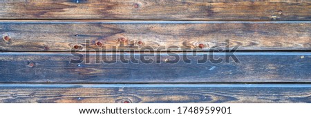 wooden boards background. aged burned black and blue wooden planks. banner Royalty-Free Stock Photo #1748959901
