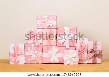 Christmas gift boxes on bokeh light background. Holiday Greeting Card.