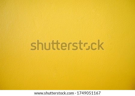 Yellow cement wall texture. Yellow concrete background, yellow wall background