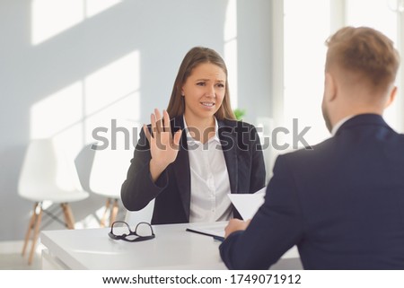 Business people discussing documents in office