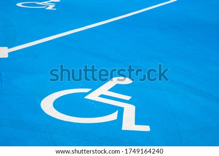 Disabled parking sign on the street in Poland. Wheelchair logo.