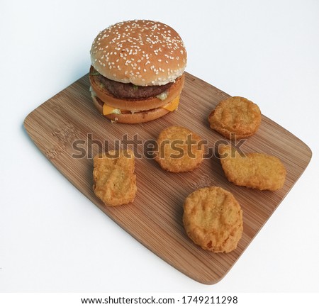 Hamburger and chicken nuggets isolated on white background. Fast food concept. Top view food.