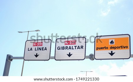 Road Sign in Spain with Gibraltar direction. Translation: La Linea, Gibraltar, Marina.