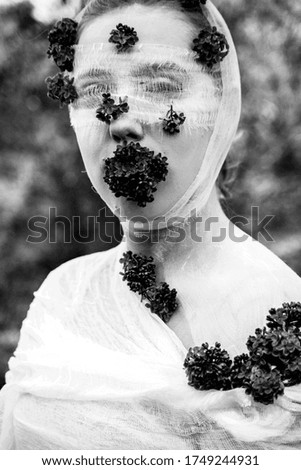The image of a girl in flowers. Portrait.