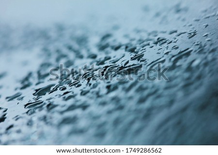 fresh raindrop in nature on clean glass for background