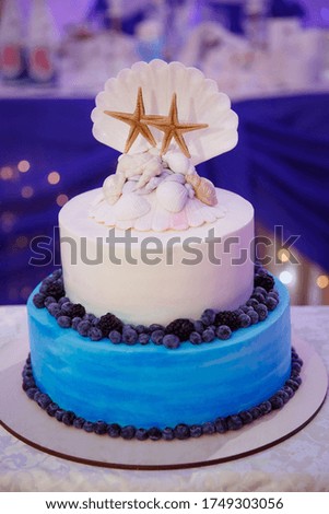 Beautiful tall wedding cake for the bride and groom