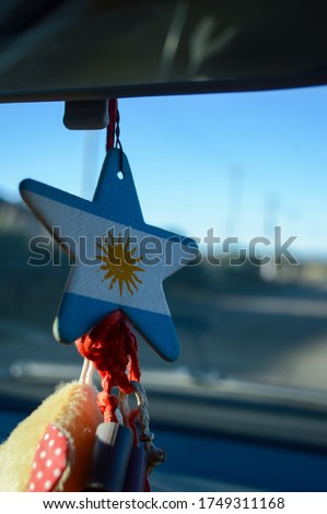 flavoring with the flag of Argentina hanging on rearview mirror