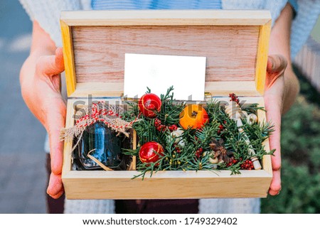 Christmas wooden gift box with honey and christmas branch decoration