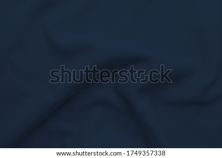 Abstract folded dark blue clothes mesh background . 