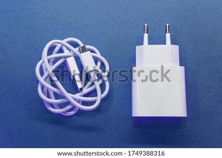 Charger box or adapter for charging a cell phone.