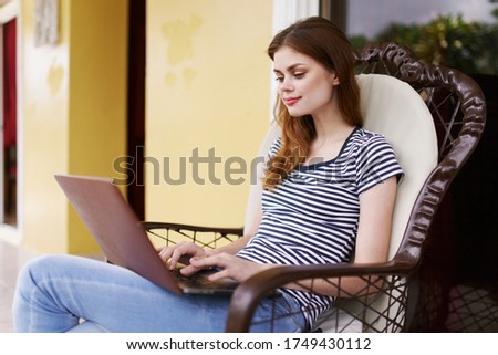 Pretty woman on the terrace fresh air laptop work communication