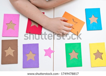 Learning colors. Matching game to find card for each star. 5 minute crafts, easy game ideas. Montessori methodology tool for focus on, concentration, speech therapy and fine motor skills.