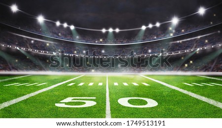 green field in american football stadium. ready for game in the 