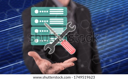 Server maintenance concept above the hand of a man in background