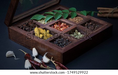 Different types of spices in wooden box Royalty-Free Stock Photo #1749529922