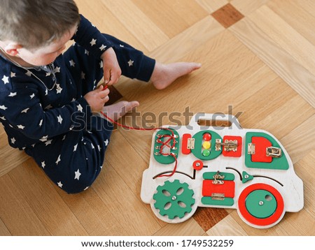 Children's educational toy. In the form of a car. Developing motor skills
