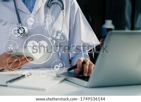 Doctor working on office desk. Medical interface icons and technology healthcare service concept. Blurred image.