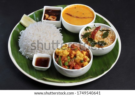 Bengali Veg Thali. Bhat, Ghee, Dal, Aloo Bhaja, phulkopi, chutney Royalty-Free Stock Photo #1749540641