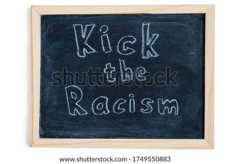 Kick the racism - written on chalkboard. Sport concept message for kid inspiration. Top view