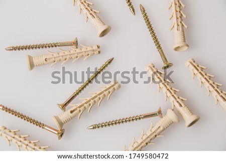 A lot of dowels on a white background, top view, pattern.