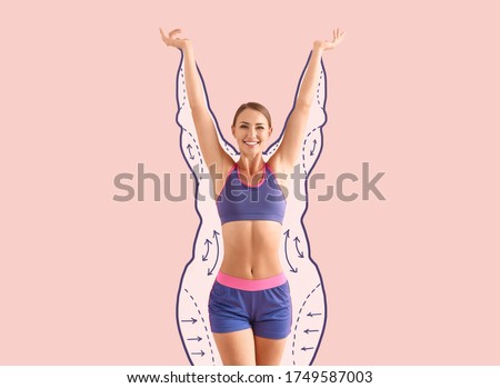 Happy sporty woman after weight loss on color background Royalty-Free Stock Photo #1749587003