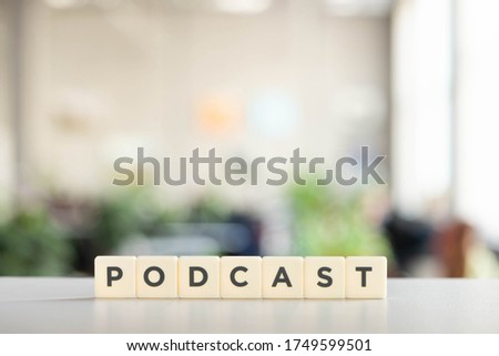 white cubes with podcast inscription on white desk