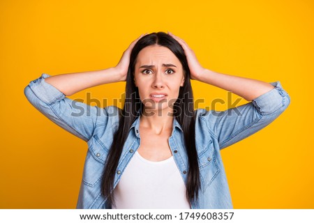 Close-up portrait of her she nice attractive pretty lovely worried depressed sullen girl oops mistake fail loss forgot isolated on bright vivid shine vibrant yellow color background Royalty-Free Stock Photo #1749608357