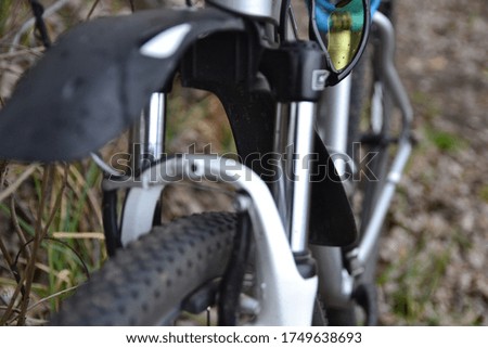 Shallow focus photography of bicycle tire. Bicycle fork.