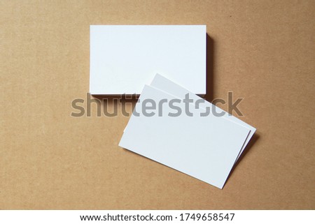 Business card on colored background. Blank name card for company logo,  Branding Mock-up. Flat lay. Copy space for text       