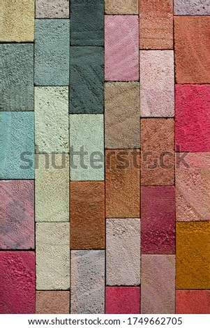 Spectrum of multi colored wooden blocks aligned. Rose and Neutral color. Background or cover for something creative or diverse.
