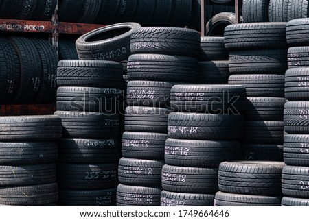 Stock of tires outside in the city.