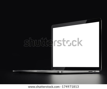 silver laptop on a black background 
