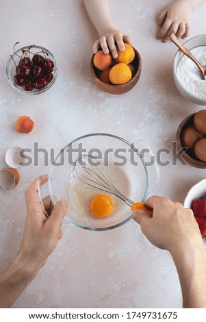 Father and child cooking on kitchen. Cozy home concept, family. Top view, flat lay
