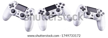 Set of white video game joysticks gamepad isolated on a white background, concept of playing games or watching TV. Royalty-Free Stock Photo #1749733172