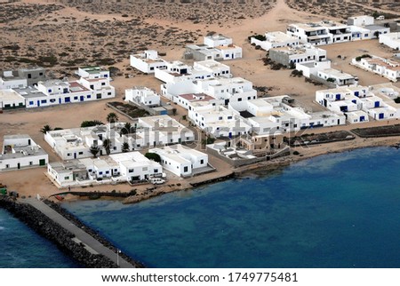 Aerial photograph of houses in the town of Caleta del Sebo on the island of La Graciosa, Canary Islands