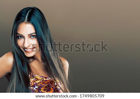 cute happy young indian real woman in studio close up smiling, f