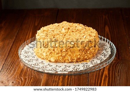Traditional fresh dessert Napoleon cake on wooden background