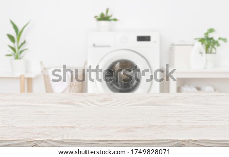 Mockup for design of empty wooden table in laundry room