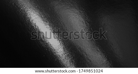 Black foil gradient texture background with highlights Royalty-Free Stock Photo #1749851024