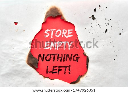 Paper hole with burned edges, text Store Empty Nothing Left on red paper in the hole. Boutique shops, stores looted, owners in despair. Aftermath concept. Protests, riots and looting in New York City.