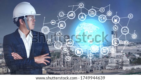 Industrial 4.0 concept.double exposure businessman and icons big data connection manufacturing technology of oil and gas refining industrial.