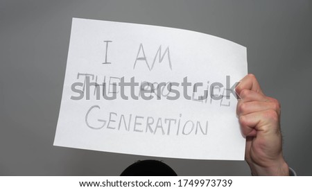 I am the pro-life generation Poster.Man holds a poster.On a white background.