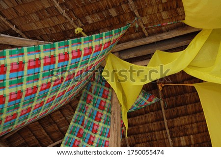 Checkered cloth banner hanging in the ceiling